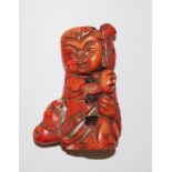Chinese red coral figure of a boy