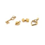 Four 9ct yellow gold charms