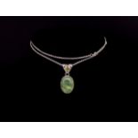Green gemstone and silver pendant and chain