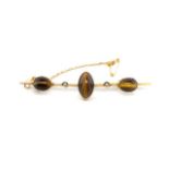 Antique tigers eye and yellow gold bar brooch