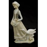 Lladro lady with duck and duckling figurine