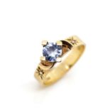 Blue gemstone and 9ct yellow gold ring