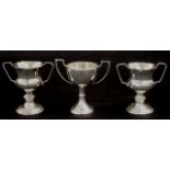 Three early miniature silver trophy cups