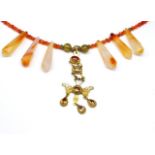 Yellow gold pendant and hardstone beaded necklace