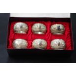 Six eastern silver plated napkin rings