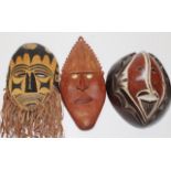 Three carved wood PNG traditional masks