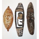 Three PNG traditional carved wood masks
