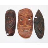 Three PNG traditional carved wood masks