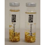 Two Sovereign Hill floating gold vials
