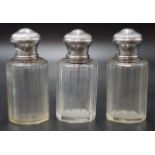 Trio of French silver topped perfume bottles