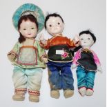 Three Eastern dressed dolls