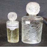 Two Eau de Rochas shop display perfume bottles