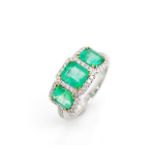 Three stone emerald and 18ct white gold ring