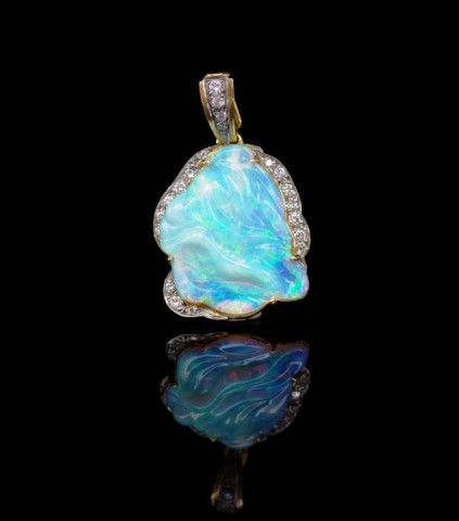 Carved opal, diamond and 18ct yellow gold enhancer