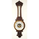 Antique carved wood aneroid barometer