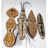 Four good PNG carved wood masks