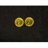Pair gilt ' NSW' pin badges