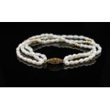 Three strand rice pearl and rose gold bracelet