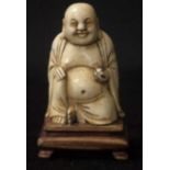 Chinese carved ivory seated figure