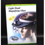 Light head magnifing glasses (unused in box)