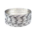 Twelve silver bangles