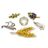 Six costume jewellery and silver brooches