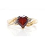 Garnet and diamond set 9ct yellow gold ring