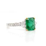 Emerald, diamond and 18ct white gold ring