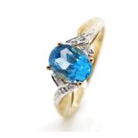 Blue gemstone and diamond set 9ct gold ring