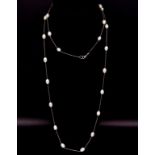 Long beaded chain and white pearl necklace