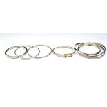 Five silver bangles