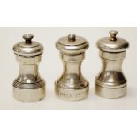 Three various USA sterling silver pepper mills