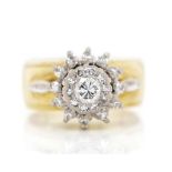 Diamond and 18ct gold daisy ring
