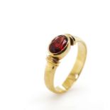 Garnet and 9ct yellow gold ring