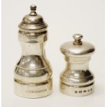 Two various English sterling silver pepper mills