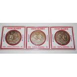 Three Cook Island $1 commemorative coins