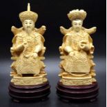 Two Chinese Immortal figurines on timber stands
