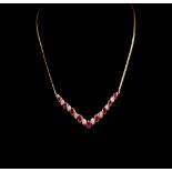 Created ruby and two tone silver gilt necklace