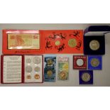 Eight assorted coin & medallion packs