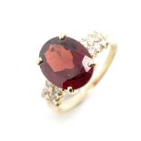 Garnet, diamond and 18ct yellow gold ring