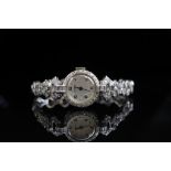 Ladies diamond, platinum and 14ct white gold watch