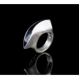 A heavy silver and black enamel knuckle ring