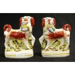 Pair of antique Staffordshire dog figures