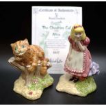 The Cheshire cat and Alice figures