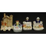 Four various C19th Staffordshire pen holders