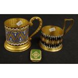 Two Continental enamel decorated cup holders