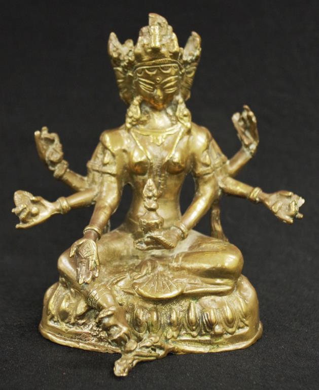 Eastern Buddhist brass Deity figure