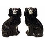 Pair of Victorian Staffordshire black dog figures