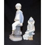 Two Lladro young boy figurines