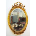 Antique ornate French gilt oval mirror